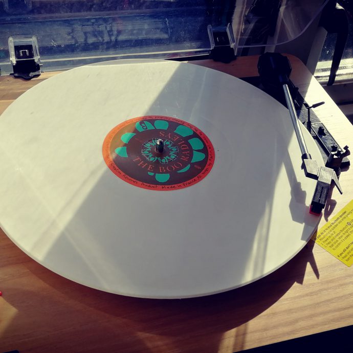 Offbeat - white record on a turntable